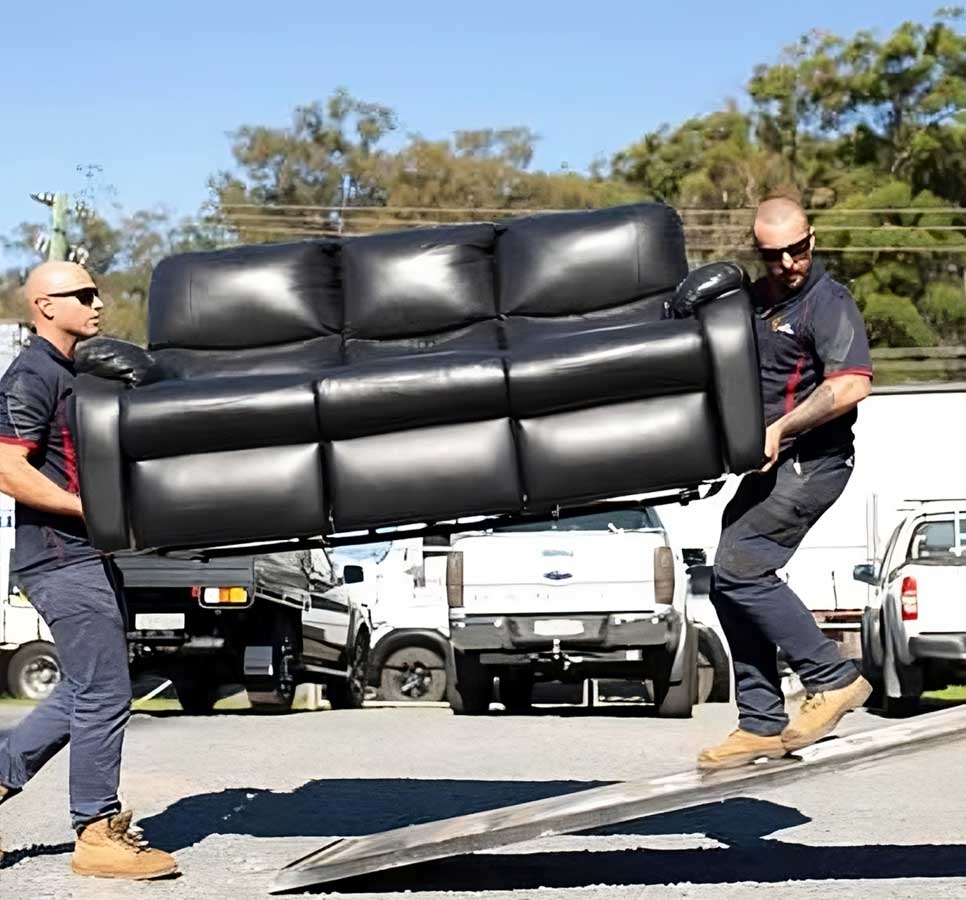 Two Men Carrying A Couch — Easy Choice Removals & General Freight in Port Macquarie, NSW