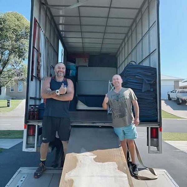 Two Men Standing In The Back Of The Open Truck — Easy Choice Removals & General Freight in Port Macquarie, NSW