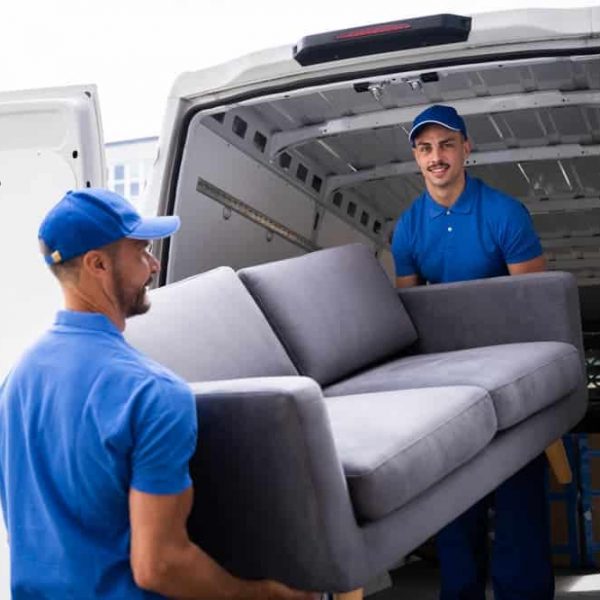 Workers Moving Furniture Into Truck — Removals & General Freight in Port Macquarie, NSW